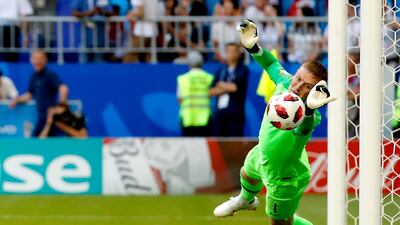 England's Jordan Pickford makes a save. Sergei Ilnitsky/EPA