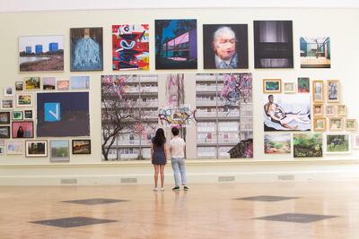 Visitors examine David Hepher's Hey Wayne on the Meath Estate. David Parry/ Royal Academy of Arts