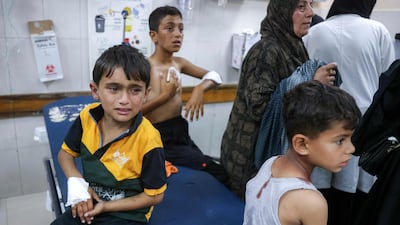 Injured children wait to be treated at Nasser Hospital in Khan Younis, southern Gaza. AFP