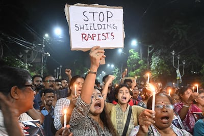 Medical professionals and activists take part in a midnight protest to condemn the rape and murder of a young medic in Kolkata. AFP