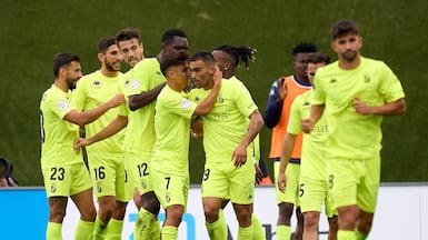 Dani Romera of AD Ceuta celebrates with teammates after scoring against Real Madrid Castilla. Getty Images