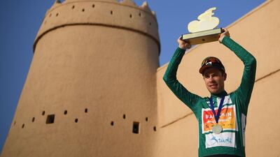 Germany's rider Phil Bauhaus of Bahrain McLaren holds his trophy after winning the last stage of the Saudi Tour from Princess Nourah University to al-Masmak near Riyadh. AFP