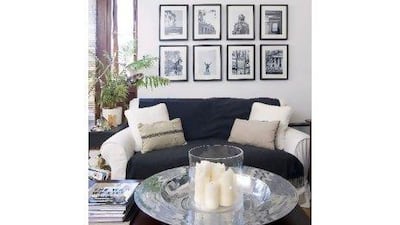 The warm wood coffee table with silver center piece in front of the sofa helps to add warmth to the livingroom. Photo: Eamon McAfee