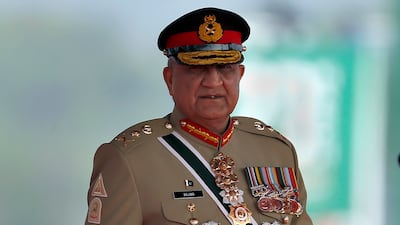 Pakistan Army Chief General Qamar Javed Bajwa arrives for a military parade to mark the country's National Day in Islamabad. Ap