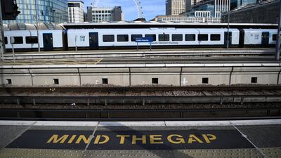 A train sits at an empty platform at Waterloo station in London. EPA