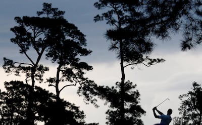 Tiger Woods hits from the fairway on the 17th hole during the second round of the US Masters. Justin Lane / EPA