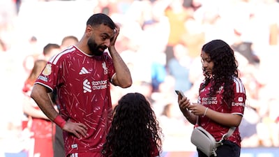 Liverpool's Mohamed Salah with daughters Makka and Kayan following the match against Brentford at Anfield. PA