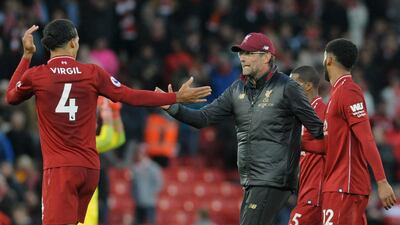 Liverpool manager Jurgen Klopp congratulates Liverpool's Virgil van Dijk, left, after their game against Manchester City. AP Photo