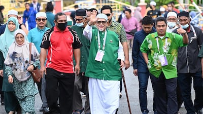 Mr Muhyiddin leads an alliance that includes the religious Pan-Malaysian Islamic Party led by Abdul Hadi Awang, centre. AFP