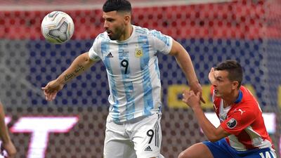 Argentina's Sergio Aguero holds off a challenge from Paraguay's Andres Cubas. AFP