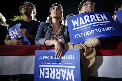 Supporters watch as Democratic presidential candidate Elizabeth Warren delivers a campaign speech in Los Angeles. AFP