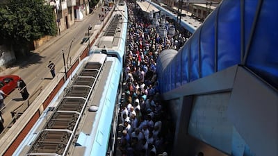Egyptians wait on the platform to board at Sayeda Zeinab metro station in Cairo.