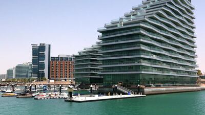Al Raha Beach apartments: Q3 down 2%. 1BR - Dh95-115,000. 2BR - Dh135-175,000. 3BR - Dh170-230,000. Q3 2013-Q3 2014 up 5%. Fatima Al Marzooqi / The National.