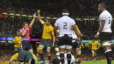 David Pocock (hidden) scores the second try for Australia in their win over Fiji. Rebecca Naden / Reuters