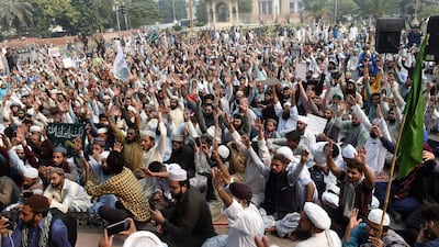 Supporters of Tehreek-e-Labaik Pakistan political party chant slogans during a protest against the court decision. AFP