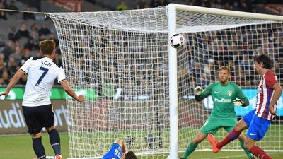 Tottenham Hotspur’s Heung-Min Son fires the ball towards Atletico’s goal during the International Champions Cup football match between English Premier League team Tottenham Hotspur and Spanish club Atletico Madrid in Melbourne on July 29, 2016. / AFP / Paul Crock