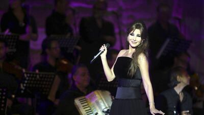 Lebanese singer Nancy Ajram performs during the 50th International Festival of Carthage at the Roman Theater of Carthage in Tunis, Tunisia, late August 12, 2014. EPA