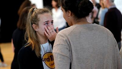 A student gets emotional after receiving her A-level exam results in Birmingham, UK. Reuters