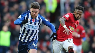 Manchester United's Fred, right, vies for the ball with Brighton Hove Albion's Aaron Connolly during the their match at Old Trafford on Sunday. EPA