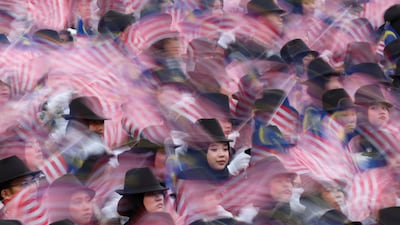 Performers wave Malaysian flags during the country's 69th National Day celebrations in Putrajaya, Malaysia. Reuters