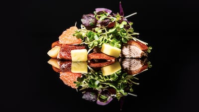 Crispy duck salad with pomelo, pine nuts and shallots. Photo: Hakkasan Abu Dhabi
