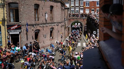 The peloton passes through the village of Cassel during Stage 4. AP
