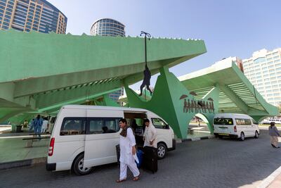 Art hangs from the Abu Dhabi Central Bus Station. Chris Whiteoak / The National