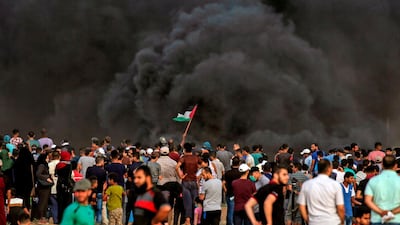 Smoke from a tyre fire rises as Palestinians protest near the border with Israel. AFP