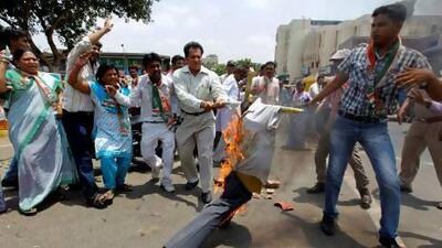 Supporters of the Congress party burn an effigy and shout anti-Chhattisgarh government slogans during a protest last month against a Maoist attack on Congress party workers. The rally highlights the complicated nature of the anti-terrorism debate in India.