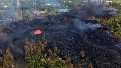 Fissure 7 in Pahoa, Hawaii. At the peak of its activity, large bubble bursts occurred at one spot, lower left, in the fissure while spattering was present in other portions. US Geological Survey via AP