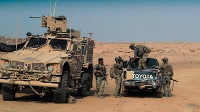 In this file photo taken on September 13, 2018 US-backed forces are pictured near the village of Susah, near the Syrian border with Iraq. AFP
