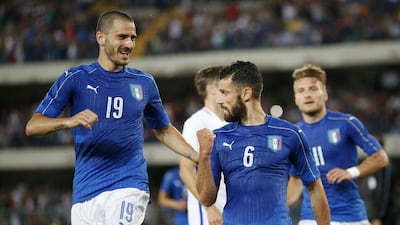 Italy's Antonio Candreva, right, celebrates with his teammate Leonardo Bonucci after scoring during the international friendly between Italy and Finland, at the Bentegodi stadium in Verona, Italy, Monday, June 6, 2016. (AP Photo/Antonio Calanni)