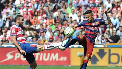 Neymar of Barcelona and David Lomban of Granada compete for the ball during the La Liga match between Granada and Barcelona at Estadio Nuevo Los Carmenes on May 14, 2016 in Granada, Spain. (Photo by Denis Doyle/Getty Images)