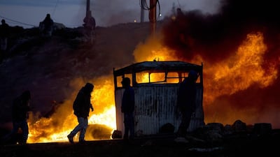 Israeli settlers burn tires and block an entrance ahead of the upcoming eviction of the illegal Jewish settlement of Amona, in the West Bank, 01 February 2017. Israeli police have deployed 3,000 policemen around the settlement ahead of the upcoming eviction. EPA/ABIR SULTAN