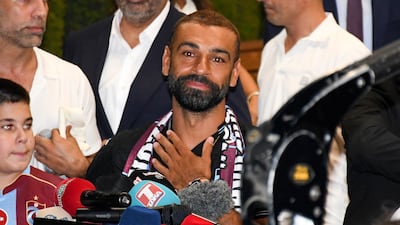 Egyptian soccer player Mohamed Salah speaks to fans waiting outside of the airport as he arrives in Trabzon, Turkey, 05 August 2026. Salah is joining Trabzonspor on a two-year contract. His official presentation will take place on 06 August. EPA / STR