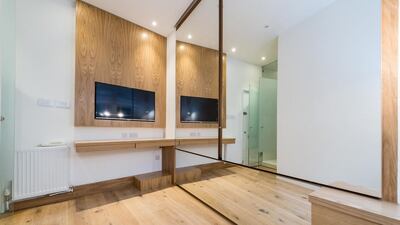 The television is mounted on the wall to save space. Courtesy Harrods Estates