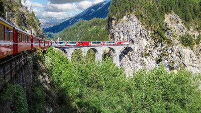 Switzerland's Glacier Express covers the scenic route between two Alpine ski resorts, Zermatt and St Moritz. Getty Images