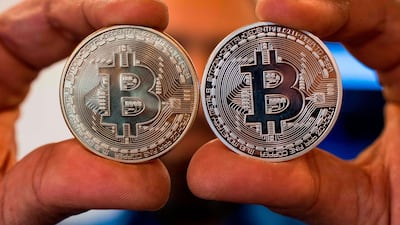 Bitcoin's dramatic boom has led to hackers targeting traders and investors in an attempt to scam them of their fortunes. Jack Guez / AFP
