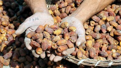 A handful of the fruit is displayed.