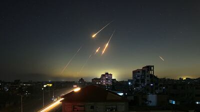 Missile trails in the sky late on Friday, seen from Nuseirat in central Gaza, as Iran attacked Israel. AFP