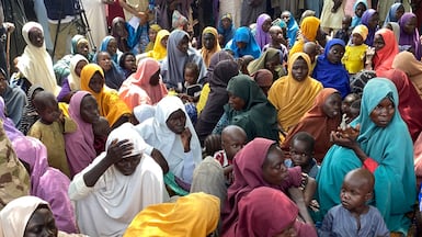 Hundreds of women and children, released by Boko Haram kidnappers, are returned to state authorities at a primary school in Gwoza, Nigeria. AFP