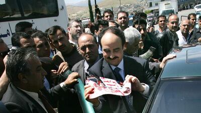In this picture taken on April 26, 2005, the former head of the Syrian political security branch Maj Gen Rustom Ghazalah is escorted by his supporters in Lebanon. AP Photo