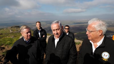 Israeli Prime Minister Benjamin Netanyahu, Republican US Senator Lindsey Graham and US ambassador to Israel David Friedman visit the border line between Israel and Syria at the Israeli-occupied Golan Heights. EPA