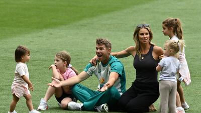 David Warner reacts as Aisha, daughter of Usman Khawaja, approaches. EPA
