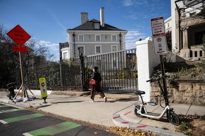 A woman walks past the former Russian Trade Mission in Washington. AFP