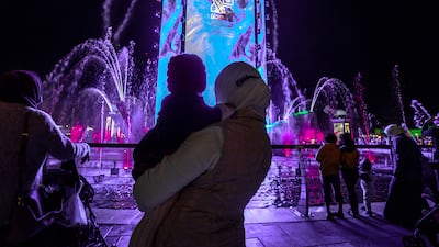 Visitors view a light display at Sheikh Zayed Heritage Festival. Victor Besa / The National