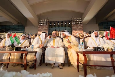 Sheikh Mohamed bin Zayed, King Mohammed VI of Morocco, and Sheikh Mohammed bin Rashid speak during the 43rd UAE National Day celebrations at Abu Dhabi National Exhibition Centre (ADNEC). They are pictured alongside Sheikh Saud bin Rashid Al Mu'alla, Ruler of Umm Al Quwain, Sheikh Humaid bin Rashid Al Nuaimi, Ruler of Ajman, and Sheikh Sultan bin Mohammed Al Qasimi, Ruler of Sharjah . Crown Prince Court.