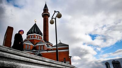 A woman walks past a mosque at Poklonnaya Hill in Moscow, Russia. AFP
