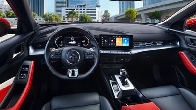 Inside the cabin, there are contrasting red or black upholstery options