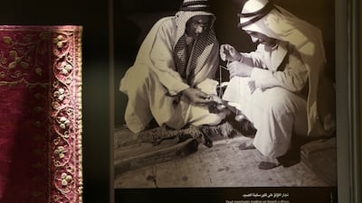 An old photograph of the pearl merchants on display at the museum.